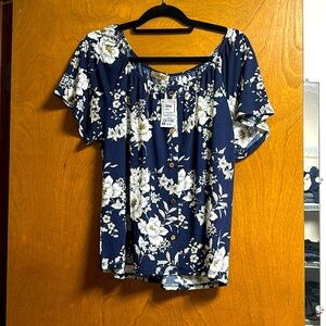 Short sleeve floral top. Button detail down front. NWT